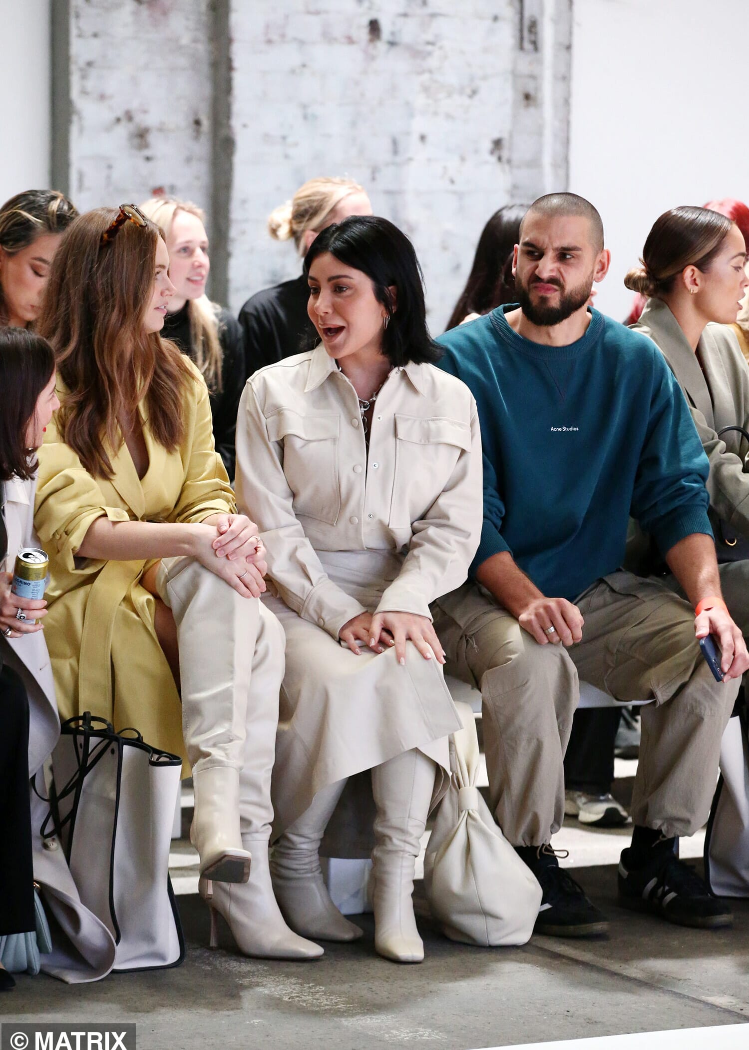 They sat front row, naturally