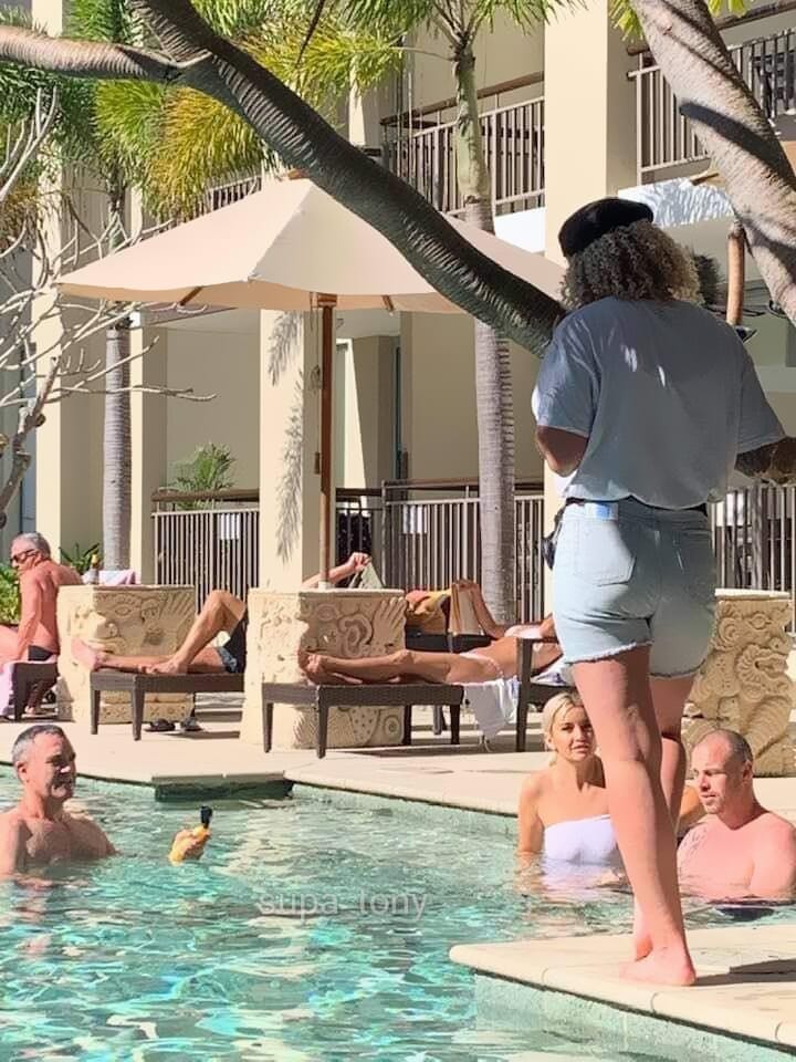 This is their producer instructing them (and the camera guy)