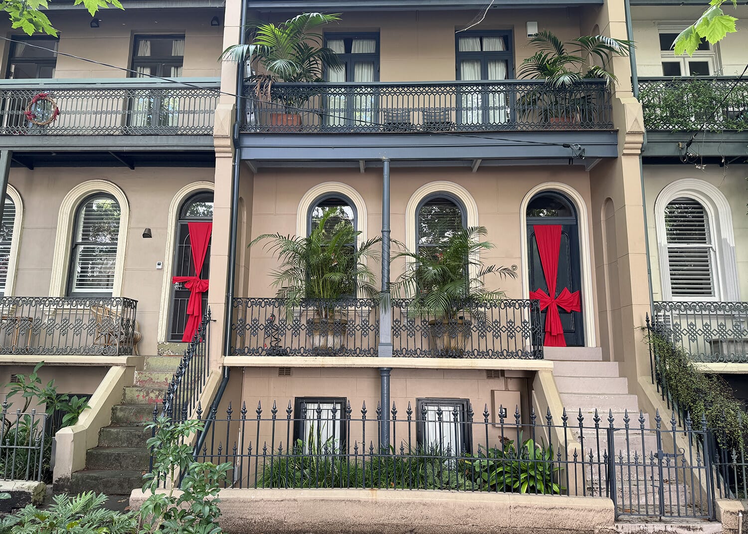 Pictured: A big red bow on a door at Bourke Street Surry Hills