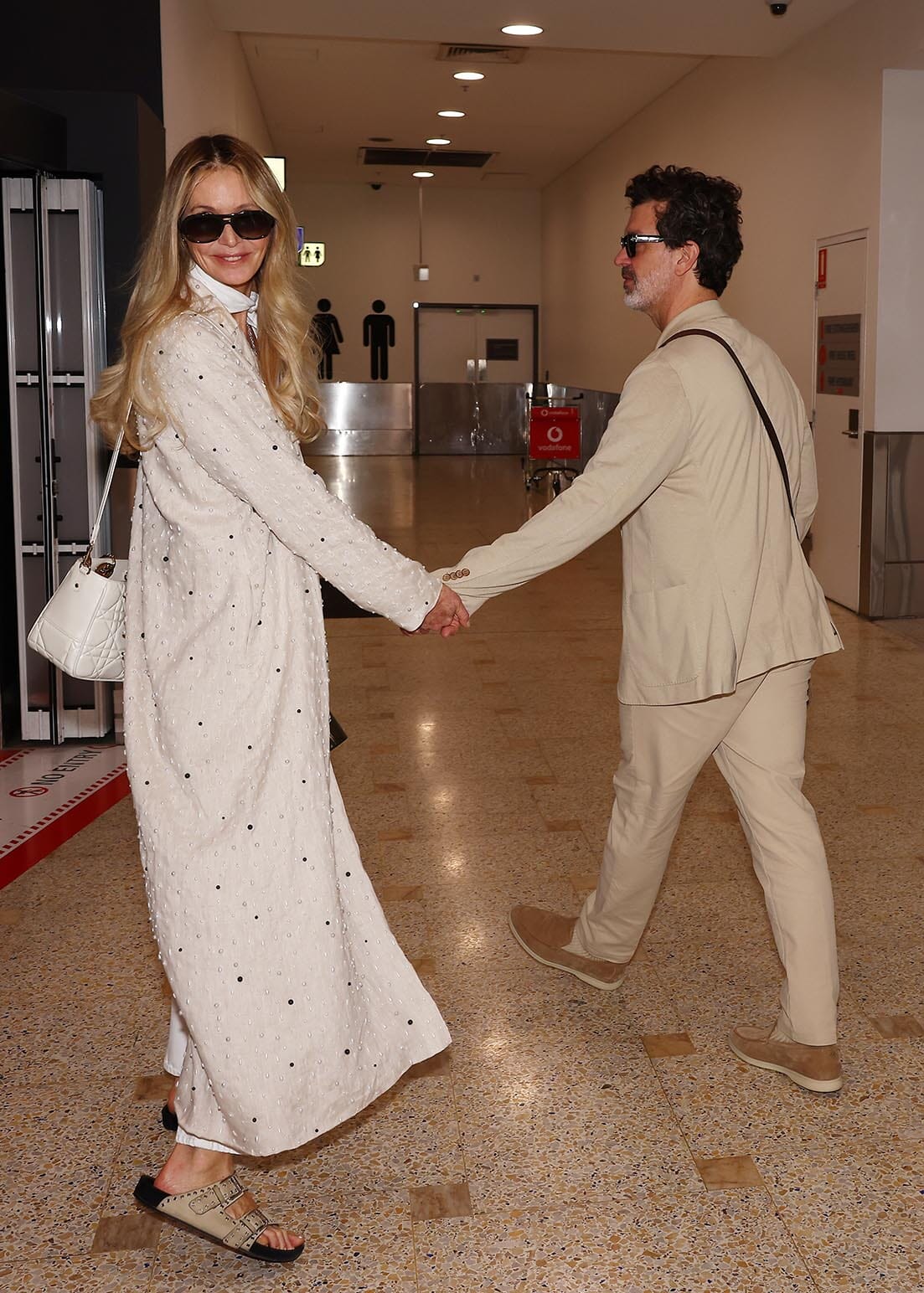 Pictured: Elle Macpherson arrives in Sydney with Doyle Bramhall
