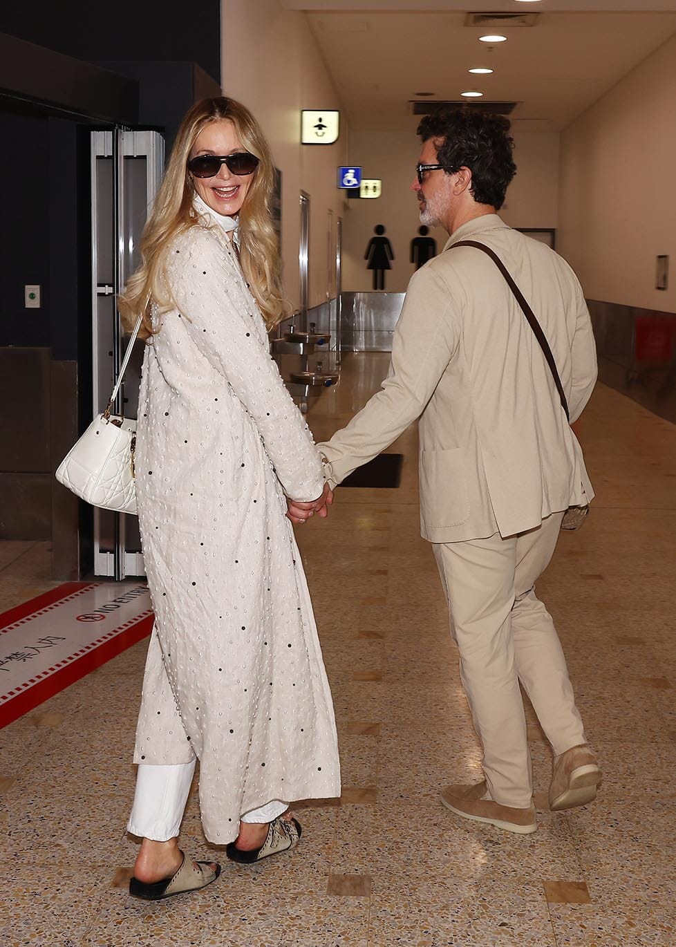 Pictured: Elle Macpherson arrives in Sydney with Doyle Bramhall