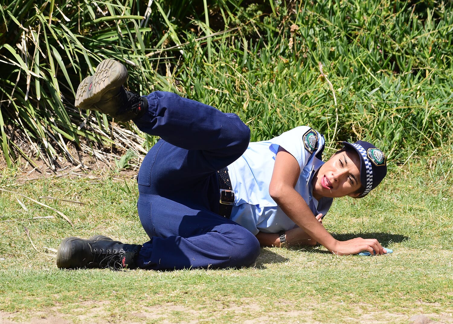 Senior constable Kat Chapman of Yabbie Creek LAC falls over while chasing a man wanted for questioning