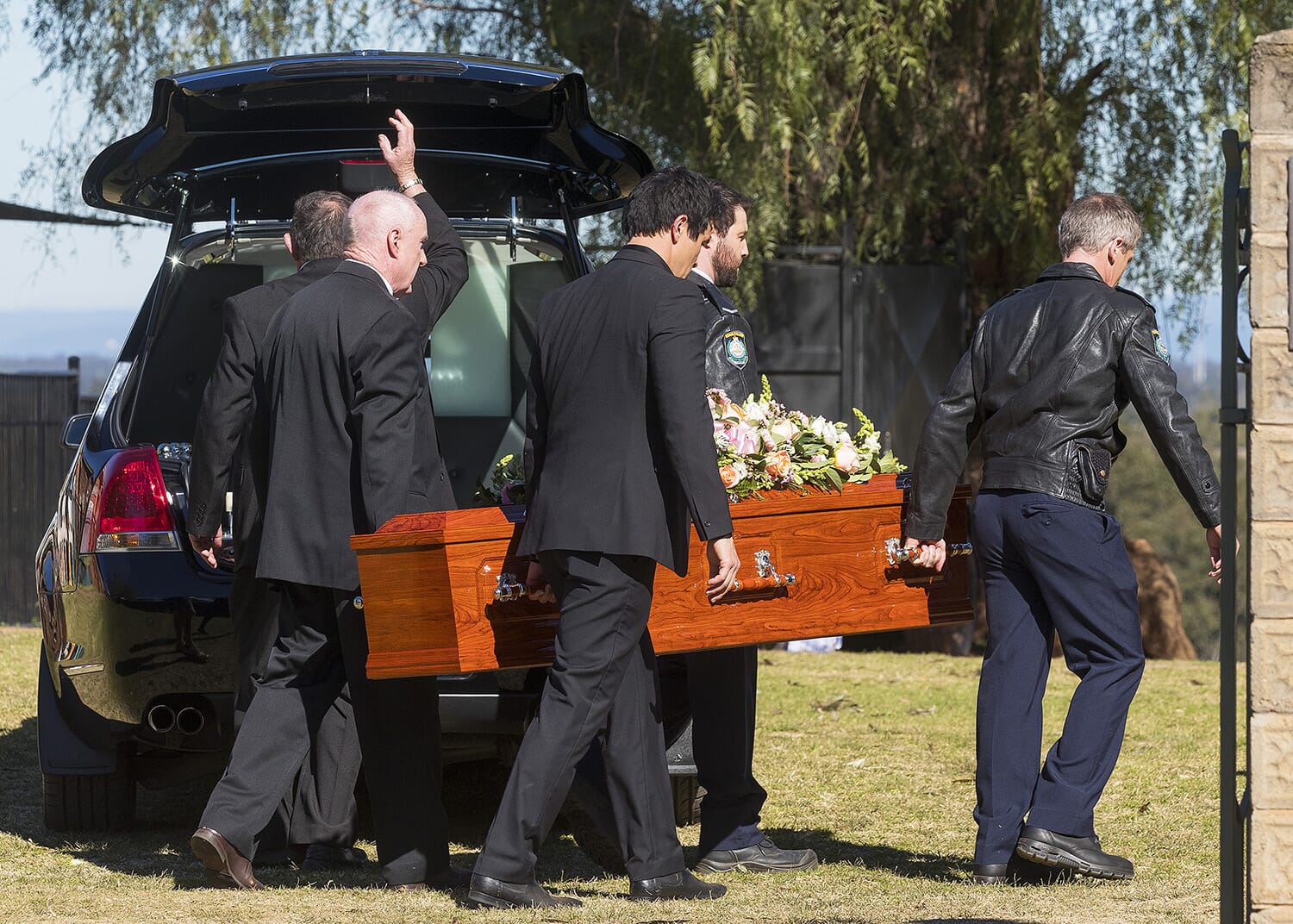 Locals carry the casket of Police office Kat Chapman who died in a fatal car crash