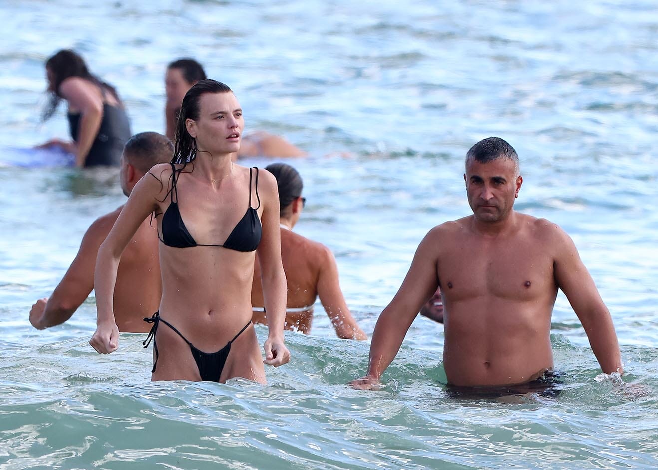 Pictured: Montana Cox & mystery man at Bondi Beach