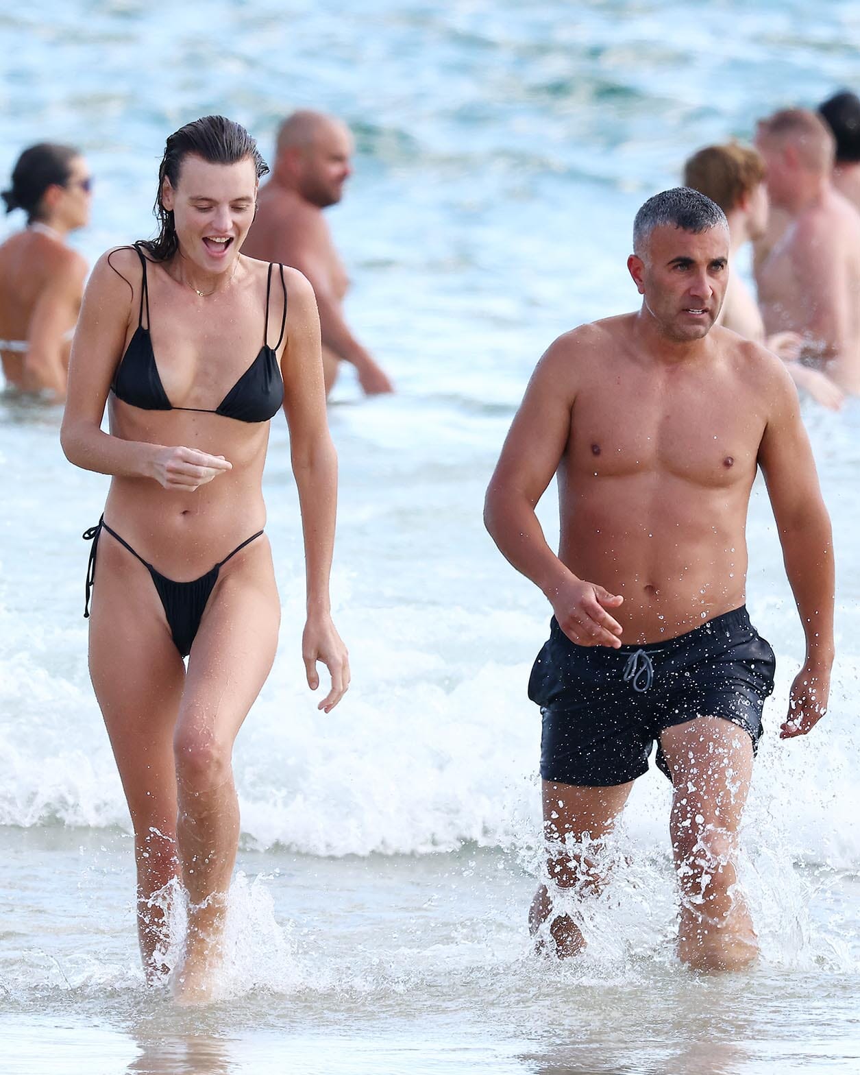 Pictured: Montana Cox & mystery man at Bondi Beach