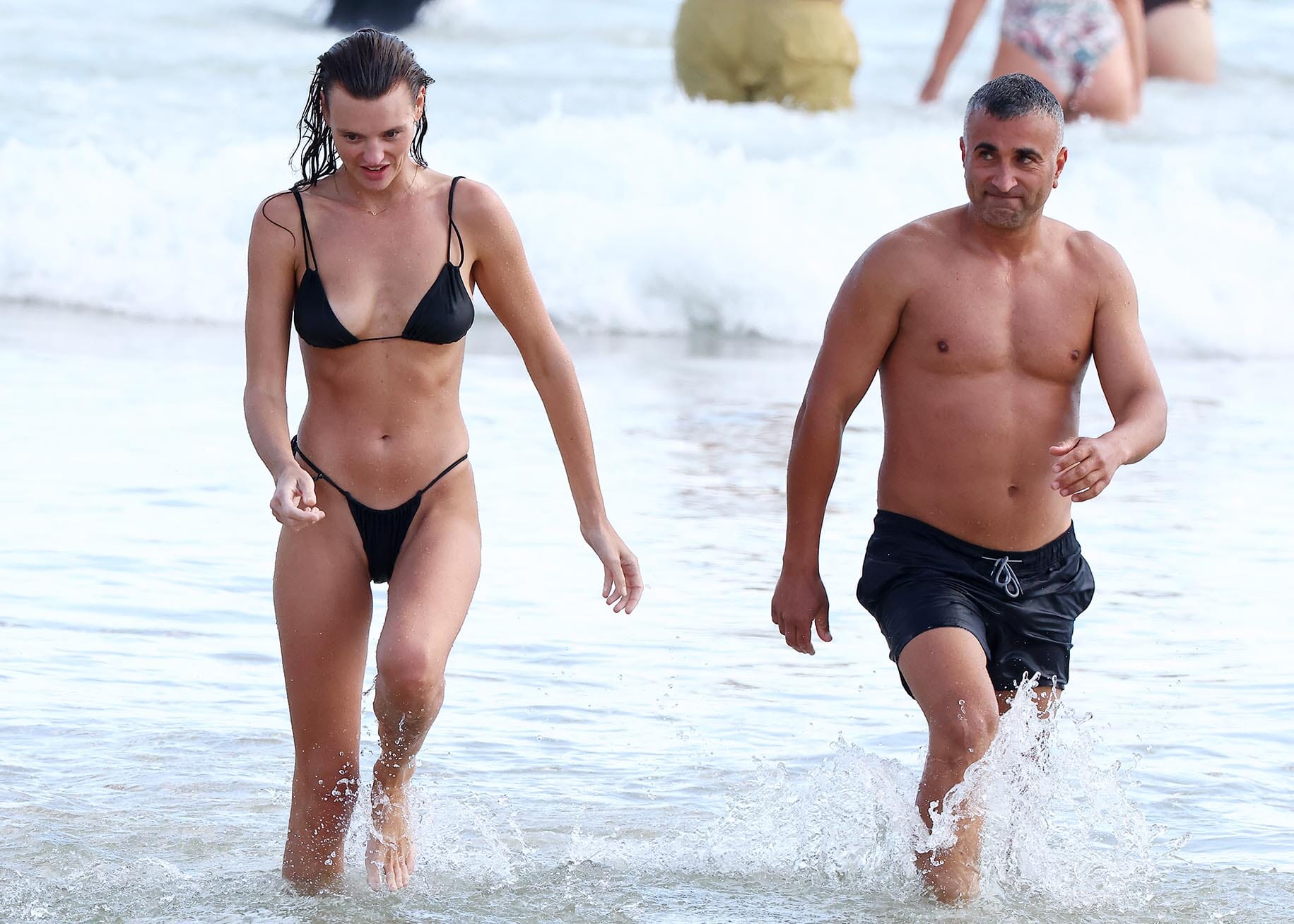 Pictured: Montana Cox & mystery man at Bondi Beach