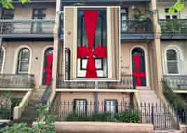 SO HOITY TOITY! The big red bows of Christmas past present and future return to the doors of Bourke Street.